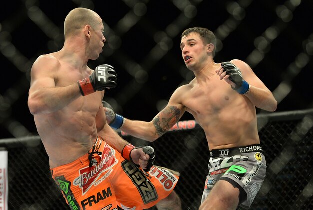 Jan 3, 2015; Las Vegas, NV, USA; Donald Cerrone (red gloves) and Myles Jury (blue gloves) in their lightweight bout at UFC 182 at MGM Grand Garden Arena. Mandatory Credit: Jayne Kamin-Oncea-USA TODAY Sports