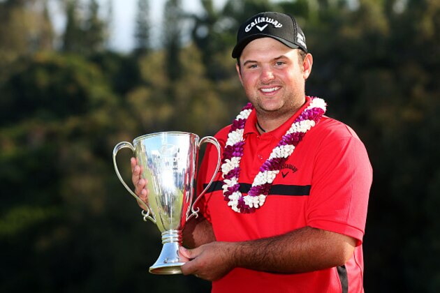 LAHAINA, HI - JANUARY 12:  Patrick Reed poses with the winner's trophy after winning during the final round of the Hyundai Tournament of Champions at Plantation Course at Kapalua Golf Club on January 12, 2015 in Lahaina, Hawaii.  (Photo by Mike Ehrmann/Getty Images)