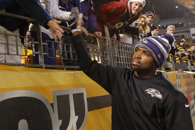 Baltimore Ravens wide receiver Torrey Smith (82) greets fans along the rail at Heinz Field as the teams warm up before an NFL wildcard playoff football game against the Pittsburgh Steelers, Saturday, Jan. 3, 2015, in Pittsburgh. (AP Photo/Gene Puskar)