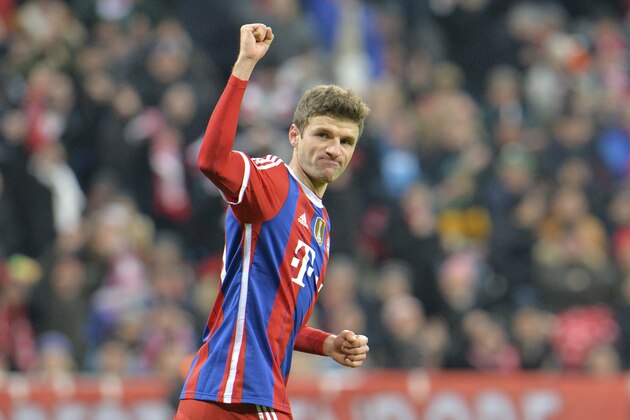 Bayern's Thomas Mueller celebrates after scoring the opening goal during the Champions League group E soccer match between FC Bayern Munich and CSKA Moscow in Munich, Germany, Wednesday, Dec. 10, 2014. (AP Photo/Kerstin Joensson)