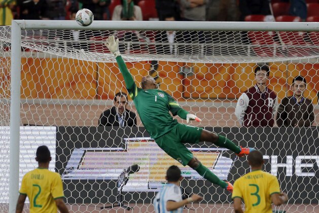 Brazil's goalkeeper Jefferson saves a shot during a Brazil vs. Argentina friendly match at the Bird's Nest National Stadium in Beijing, China, Saturday, Oct. 11, 2014. (AP Photo/Ng Han Guan)