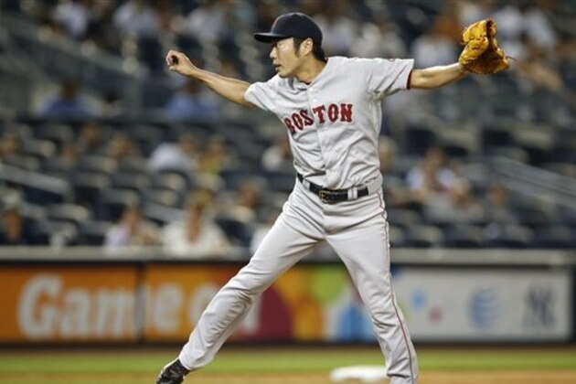 Boston Red Sox relief pitcher Koji Uehara follows through on a pitch in the ninth inning of a baseball game against the New York Yankees at Yankee Stadium in New York, Tuesday, Sept. 2, 2014. The Red Sox defeated the Yankees 9-4. (AP Photo/Kathy Willens)