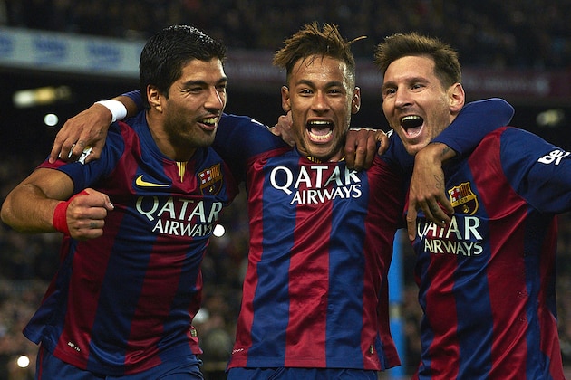 FC Barcelona's Lionel Messi, from Argentine, right, Neymar, from Brazil, center, and Luis Suarez, from Uruguay, celebrate after scoring against Atletico Madrid during a Spanish La Liga soccer match at the Camp Nou stadium in Barcelona, Spain, Sunday, Jan. 11, 2015. (AP Photo/Siu Wu)