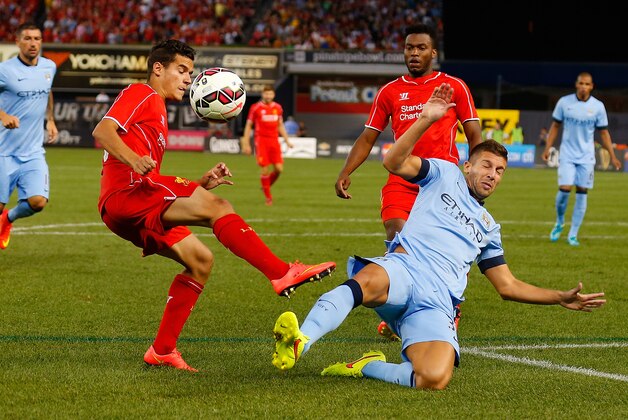 NEW YORK, NY - JULY 30:  Matija Nastasic #33 of Manchester City and Philippe Coutinho #10 of Liverpool vie for the ball during the International Champions Cup 2014 at Yankee Stadium on July 30, 2014 in the Bronx borough of New York City.  (Photo by Mike Stobe/Getty Images)