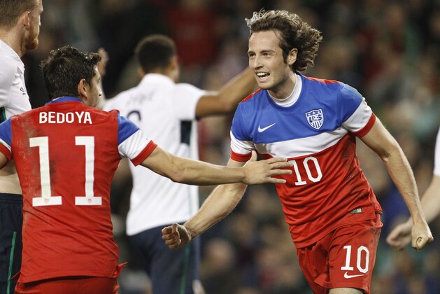 United States' Mix Diskerud, right, and Alejandro Bedoya celebrate after scoring a goal against Republic of Ireland during the international friendly soccer match between the at the Aviva stadium, Dublin, Ireland, Tuesday, Nov. 18, 2014. (AP Photo/Peter Morrison)