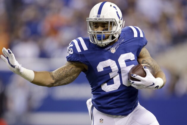 Indianapolis Colts running back Daniel Herron runs with the ball during the first half of an NFL wildcard playoff football game against the Cincinnati Bengals Sunday, Jan. 4, 2015, in Indianapolis. (AP Photo/AJ Mast)