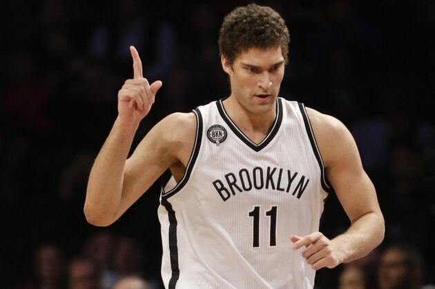 Brooklyn Nets' Brook Lopez (11) reacts after making a 3-point basket during the first half of an NBA basketball game against the Philadelphia 76ers, Friday, Jan. 9, 2015, in New York. (AP Photo/Frank Franklin II)