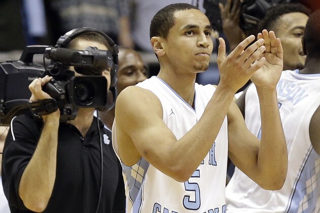 North Carolina's Marcus Paige (5) celebrates after his game winning shot to defeat Louisville 72-71 following an NCAA college basketball game in Chapel Hill, N.C., Saturday, Jan. 10, 2015. North Carolina won 72-71. (AP Photo/Gerry Broome)