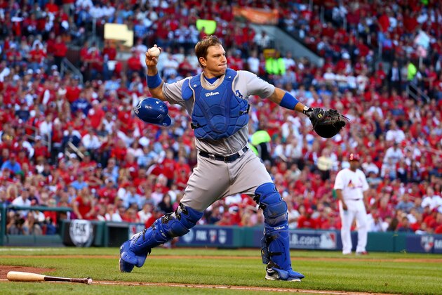 ST LOUIS, MO - OCTOBER 07: A.J. Ellis #17 of the Los Angeles Dodgers throws out Kolten Wong #16 of the St. Louis Cardinals to end the fifth inning in Game Four of the National League Divison Series at Busch Stadium on October 7, 2014 in St Louis, Missouri.  (Photo by Dilip Vishwanat/Getty Images)