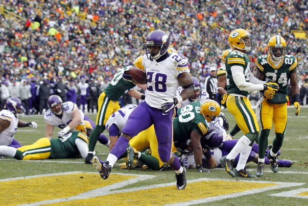 Minnesota Vikings' Adrian Peterson breaks into the end zone for a touchdown run during the first half of an NFL football game against the Green Bay Packers Sunday, Nov. 24, 2013, in Green Bay, Wis. (AP Photo/Mike Roemer) Minnesota Vikings' Adrian Peterson breaks into the end zone for a touchdown run during the first half of an NFL football game against the Green Bay Packers Sunday, Nov. 24, 2013, in Green Bay, Wis. (AP Photo/Mike Roemer)