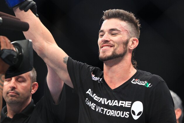 Aug 27, 2013; Indianapolis, IN, USA; Brandon Thatch celebrates after beating Justin Edwards during UFC Fight Night 27 at Bankers Life Fieldhouse. Mandatory Credit: Pat Lovell-USA TODAY Sports