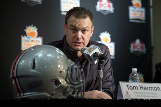 FILE - This Jan. 3, 2014, file photo, Ohio State offensive coordinator Tom Herman talks to the media during an NCAA college football news conference in Fort Lauderdale, Fla. For most coaches it’s the achievement of a lifetime, working with a team that’s in the national championship game. But for Ohio State offensive coordinator and quarterbacks coach Tom Herman, this is a fun but stressful time while he juggles two jobs. (AP Photo/J Pat Carter, File) FILE - This Jan. 3, 2014, file photo, Ohio State offensive coordinator Tom Herman talks to the media during an NCAA college football news conference in Fort Lauderdale, Fla. For most coaches it’s the achievement of a lifetime, working with a team that’s in the national championship game. But for Ohio State offensive coordinator and quarterbacks coach Tom Herman, this is a fun but stressful time while he juggles two jobs. (AP Photo/J Pat Carter, File)