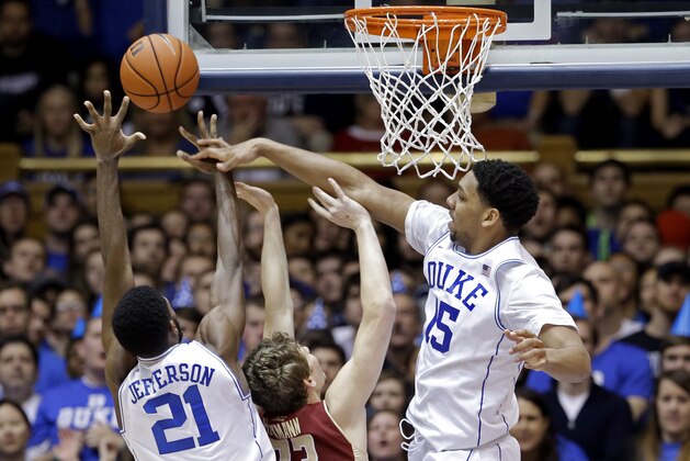Duke's Jahlil Okafor (15) and Amile Jefferson (21) block Boston College's Patrick Heckmann (33) during the first half of an NCAA college basketball game in Durham, N.C., Saturday, Jan. 3, 2015. (AP Photo/Gerry Broome)
