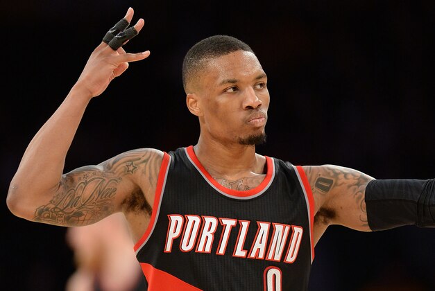 Jan 11, 2015; Los Angeles, CA, USA;  Portland Trail Blazers guard Damian Lillard (0) heads down court after a three point basket in the second half of the game against the Los Angeles Lakers at Staples Center. Trailblazers won 104-96. Mandatory Credit: Jayne Kamin-Oncea-USA TODAY Sports