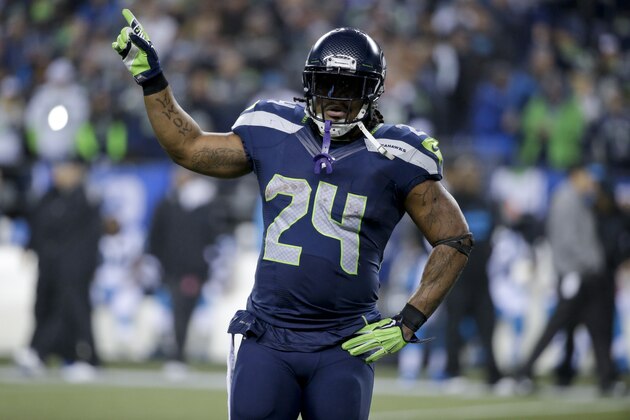 Seattle Seahawks running back Marshawn Lynch against the Carolina Panthers during the second half of an NFL divisional playoff football game in Seattle, Saturday, Jan. 10, 2015. (AP Photo/Elaine Thompson)
