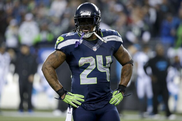 Seattle Seahawks running back Marshawn Lynch watches against the Carolina Panthers during the second half of an NFL divisional playoff football game in Seattle, Saturday, Jan. 10, 2015. (AP Photo/Elaine Thompson)