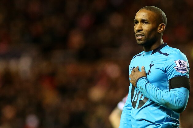 Tottenham Hotspurs' Jermain Defoe is seen wearing a black armband as a sign of respect to mark the life of former South African President Nelson Mandela, during their English Premier League soccer match against Sunderland at the Stadium of Light, Sunderland, England, Saturday, Dec. 7, 2013. (AP Photo/Scott Heppell)