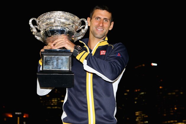 MELBOURNE, AUSTRALIA - JANUARY 28:  Novak Djokovic of Serbia poses with the Norman Brookes Challenge Cup in the early hours of January 28, 2013 after winning his men's final match against Andy Murray of Great Britain during day fourteen of the 2013 Australian Open at Melbourne Park on January 27, 2013 in Melbourne, Australia.  (Photo by Lucas Dawson/Getty Images)
