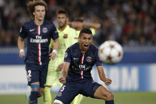 PSG's Marquinhos reacts after Barcelona failed to score during the Champions League soccer match between PSG and Barcelona, at the Parc des Princes stadium, in Paris, Tuesday, Sept. 30, 2014. (AP Photo/Christophe Ena)