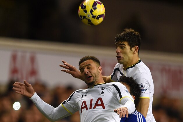 LONDON, ENGLAND - JANUARY 01:  Diego Costa of Chelsea is caught between Kyle Walker and Federico Fazio of Spurs as he jumps for the ball during the Barclays Premier League match between Tottenham Hotspur and Chelsea at White Hart Lane on January 1, 2015 in London, England.  (Photo by Michael Regan/Getty Images)