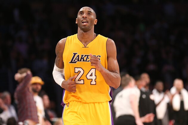 LOS ANGELES, CA - JANUARY 13:  Kobe Bryant #24 of the Los Angeles Lakers reacts as he runs off the court after missing his three point attempt to tie the score as time ran out in the game against the Miami Heat at Staples Center on January 13, 2015 in Los Angeles, California. The Heat won 78-75.   NOTE TO USER: User expressly acknowledges and agrees that, by downloading and or using this photograph, User is consenting to the terms and conditions of the Getty Images License Agreement.  (Photo by Stephen Dunn/Getty Images)