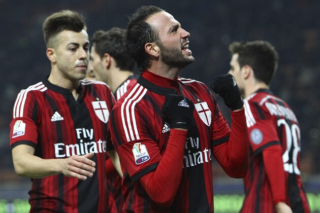 MILAN, ITALY - JANUARY 13:  Giampaolo Pazzini of AC Milan celebrates after scoring the opening goal during the TIM Cup match between AC Milan and US Sassuolo Calcio at Stadio Giuseppe Meazza on January 13, 2015 in Milan, Italy.  (Photo by Marco Luzzani/Getty Images)