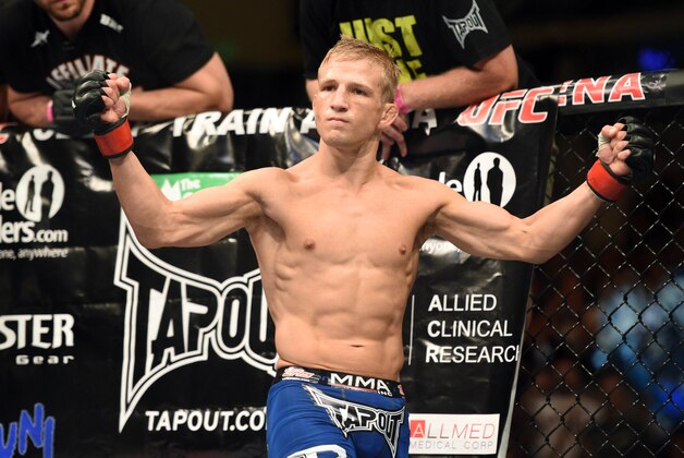August 30, 2014; Sacramento, CA, USA; T.J. Dillashaw (red gloves) reacts before his fight against Joe Soto (not pictured) during the bantamweight title bout of UFC 177 at Sleep Train Arena. Mandatory Credit: Kyle Terada-USA TODAY Sports