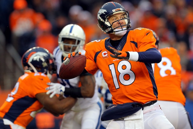 DENVER, CO - JANUARY 11:  Peyton Manning #18 of the Denver Broncos passes against the Indianapolis Colts   during a 2015 AFC Divisional Playoff game at Sports Authority Field at Mile High on January 11, 2015 in Denver, Colorado.  (Photo by Justin Edmonds/Getty Images)