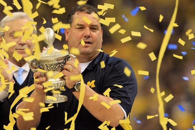 NEW ORLEANS, LA - JANUARY 03:  Head coach Brady Hoke of the Michigan Wolverines celebrates with the trophy after Michigan won 23-20 in overtime against the Virginia Tech Hokies during the Allstate Sugar Bowl at Mercedes-Benz Superdome on January 3, 2012 in New Orleans, Louisiana.  (Photo by Matthew Stockman/Getty Images)