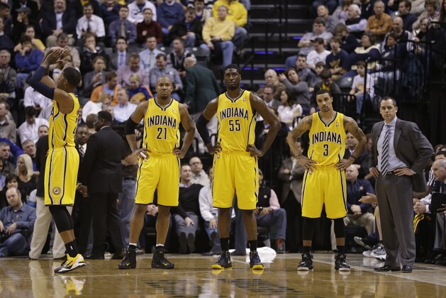 Indiana Pacers' Paul George (24), David West (21), Roy Hibbert (55), George Hill (3), and head coach Frank Vogel wait for the start of play during the first half of an NBA basketball game against the New York Knicks Thursday, Jan. 10, 2013, in Indianapolis. (AP Photo/Darron Cummings)