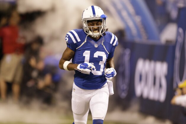 Indianapolis Colts' T.Y. Hilton (13) in introduced before a NFL wildcard playoff football game between the Indianapolis Colts and the Cincinnati Bengals Sunday, Jan. 4, 2015, in Indianapolis. (AP Photo/Michael Conroy)