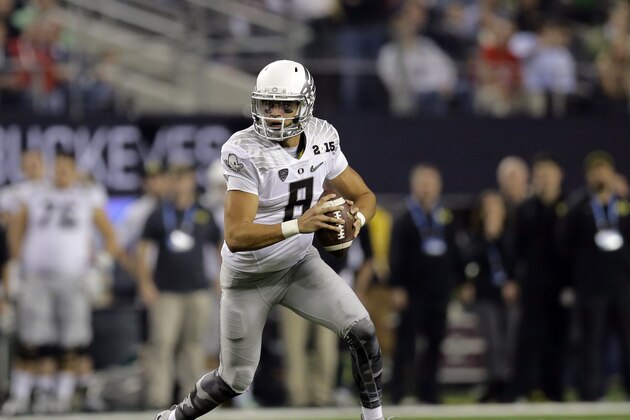 Oregon quarterback Marcus Mariota (8) looks to throw during the first half of the NCAA college football playoff championship game against Ohio State Monday, Jan. 12, 2015, in Arlington, Texas. (AP Photo/Eric Gay) Oregon quarterback Marcus Mariota (8) looks to throw during the first half of the NCAA college football playoff championship game against Ohio State Monday, Jan. 12, 2015, in Arlington, Texas. (AP Photo/Eric Gay)
