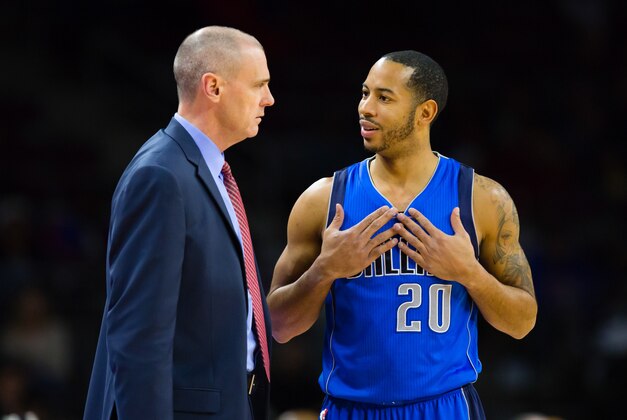 Dec 17, 2014; Auburn Hills, MI, USA; Dallas Mavericks head coach Rick Carlisle talks to guard Devin Harris (20) in the first half against the Detroit Pistons at The Palace of Auburn Hills. Mandatory Credit: Rick Osentoski-USA TODAY Sports