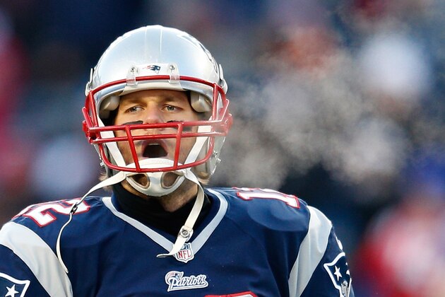 FOXBORO, MA - JANUARY 10:  Tom Brady #12 of the New England Patriots warms up before the 2014 AFC Divisional Playoffs game against the Baltimore Ravens at Gillette Stadium on January 10, 2015 in Foxboro, Massachusetts.  (Photo by Jim Rogash/Getty Images)