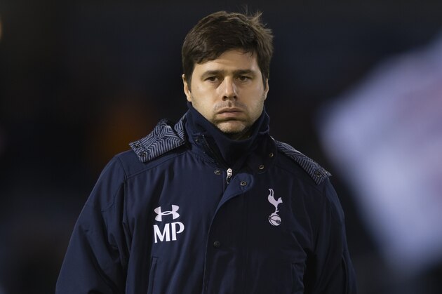 Tottenham's manager Mauricio Pochettino takes to the touchline before his team's English FA Cup third round soccer match against Burnley at Turf Moor Stadium, Burnley, England, Monday, Jan. 5, 2015. (AP Photo/Jon Super)