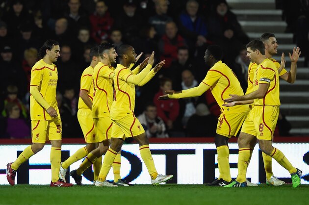 BOURNEMOUTH, ENGLAND - DECEMBER 17:  Raheem Sterling of Liverpool celebrates scoring his team's third goal with Steven Gerrard during the Capital One Cup Quarter-Final match between Bournemouth and Liverpool at Goldsands Stadium on December 17, 2014 in Bournemouth, England.  (Photo by Mike Hewitt/Getty Images)