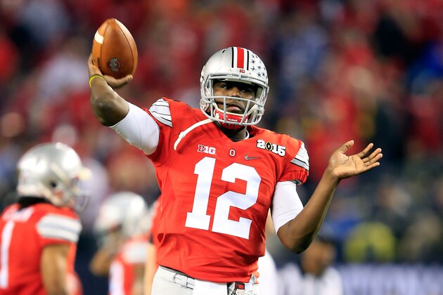 ARLINGTON, TX - JANUARY 12:  Quarterback Cardale Jones #12 of the Ohio State Buckeyes throws a ball during warm-ups before taking on the Oregon Ducks in the College Football Playoff National Championship Game at AT&T Stadium on January 12, 2015 in Arlington, Texas.  (Photo by Jamie Squire/Getty Images)