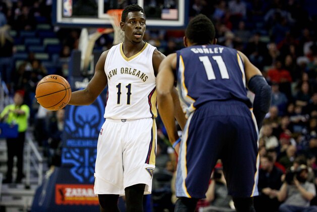 Jan 9, 2015; New Orleans, LA, USA; New Orleans Pelicans guard Jrue Holiday (11) is guarded by Memphis Grizzlies guard Mike Conley (11) during a game at the Smoothie King Center. The Pelicans defeated the Grizzlies 106-95. Mandatory Credit: Derick E. Hingle-USA TODAY Sports