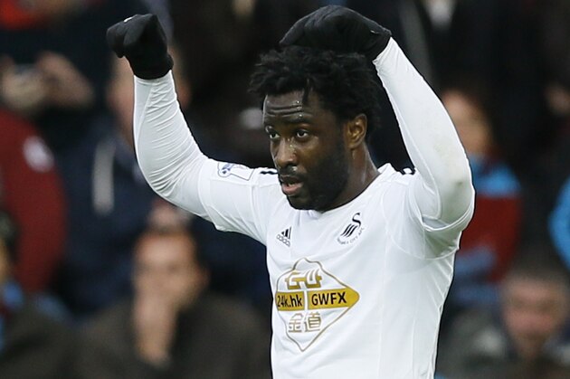 Swansea's Wilfried Bony celebrates scoring a goal during the English Premier League soccer match between West Ham and Swansea at White Hart Lane stadium in London, Sunday, Dec. 7, 2014. (AP Photo/Kirsty Wigglesworth)