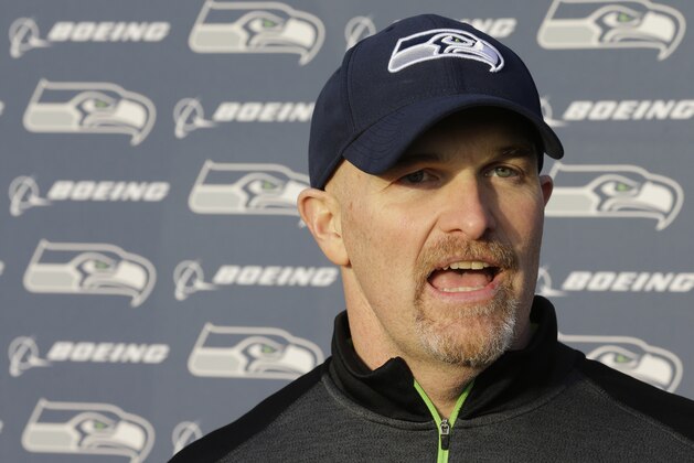 Seattle Seahawks defensive coordinator Dan Quinn talks to reporters after practice Wednesday, Jan. 7, 2015 in Renton, Wash. The Seahawks will play the Carolina Panthers on Saturday in an NFL football divisional playoff game. (AP Photo/Ted S. Warren)