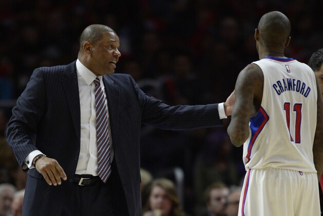 Jan 3, 2015; Los Angeles, CA, USA; Los Angeles Clippers head coach Doc Rivers talks with Los Angeles Clippers guard Jamal Crawford (11) during the fourth quarter against the Philadelphia 76ers at Staples Center. The Los Angeles Clippers won 127-91. Mandatory Credit: Kelvin Kuo-USA TODAY Sports