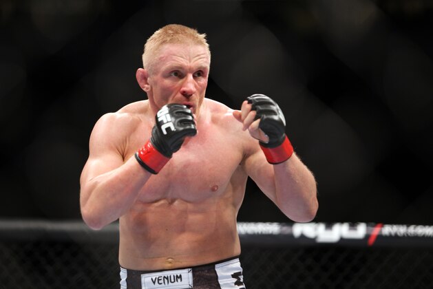 Dennis Siver in action against Nam Phan during a mixed martial arts bout at a UFC on FOX event in Seattle, Saturday, Dec. 8, 2012. Siver won via 3-round unanimous decision. (AP Photo/Gregory Payan)