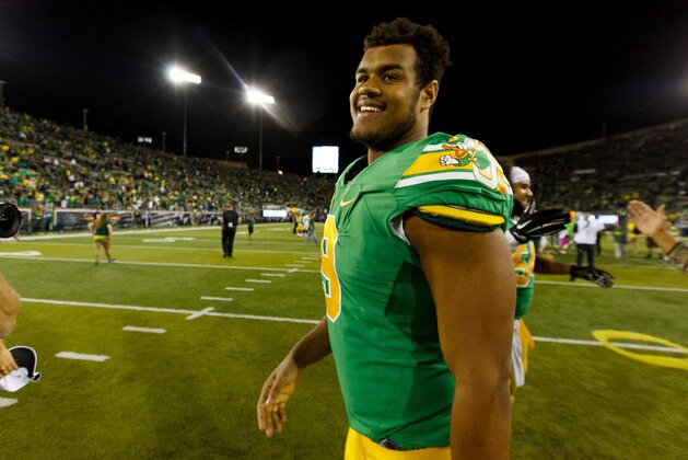 Oregon defensive lineman Arik Armstead (9) smiles after an NCAA college football game against Washington in Eugene, Ore., Saturday, Oct. 18, 2014. (AP Photo/Ryan Kang)