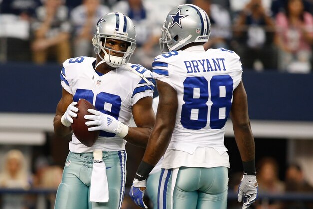 Jan 4, 2015; Arlington, TX, USA; Dallas Cowboys running back DeMarco Murray (29) and  wide receiver Dez Bryant (88) talk on the field before the game against the Detroit Lions in the NFC Wild Card Playoff Game at AT&T Stadium. Dallas beat Detroit 24-20. Mandatory Credit: Tim Heitman-USA TODAY Sports