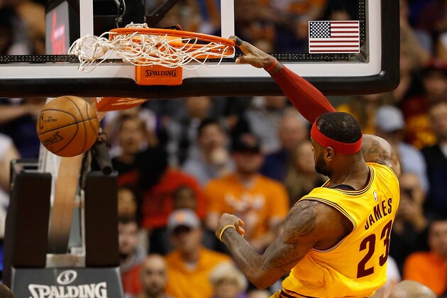 PHOENIX, AZ - JANUARY 13:  LeBron James #23 of the Cleveland Cavaliers slam dunks the ball during the NBA game against the Phoenix Suns at US Airways Center on January 13, 2015 in Phoenix, Arizona. The Suns defeated the Cavaliers 107-100. NOTE TO USER: User expressly acknowledges and agrees that, by downloading and or using this photograph, User is consenting to the terms and conditions of the Getty Images License Agreement.  (Photo by Christian Petersen/Getty Images)