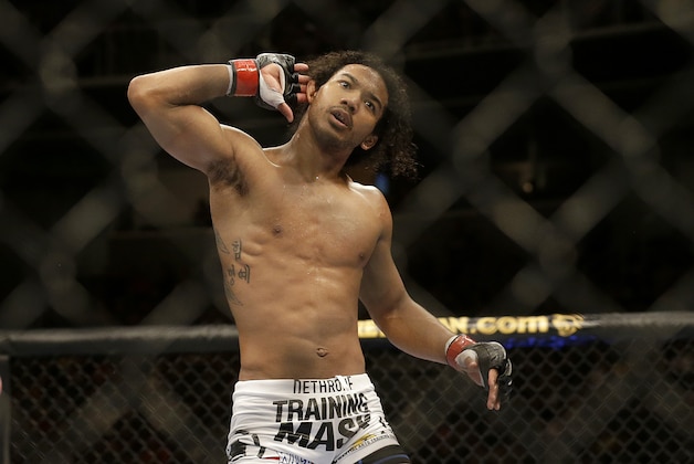 Benson Henderson gestures while fighting Gilbert Melendez in a UFC lightweight championship mixed martial arts fight in San Jose, Calif., Saturday, April 20, 2013. Henderson won by split decision to retain the championship. (AP Photo/Jeff Chiu)