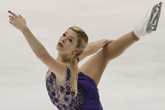 Gracie Gold of the United States performs during the women’s free skating of the NHK Trophy figure skating in Osaka, western Japan, Saturday, Nov. 29, 2014. (AP Photo/Shizuo Kambayashi)