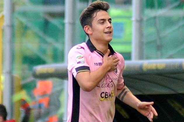 Palermo's Paulo Dybala celebrates after scoring during the Serie A soccer match between Palermo and Cagliari, in Palermo, Italy, Tuesday, Jan. 6,  2015. (AP Photo/Alessandro Fucarini)