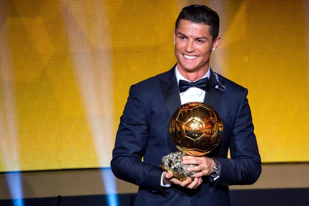 ZURICH, SWITZERLAND - JANUARY 12: Cristiano Ronaldo of Portugal and Real Madrid receives the 2014 FIFA Ballon d'Or award for the player of the year during the FIFA Ballon d'Or Gala 2014 at the Kongresshaus on January 12, 2015 in Zurich, Switzerland. (Photo by Philipp Schmidli/Getty Images)