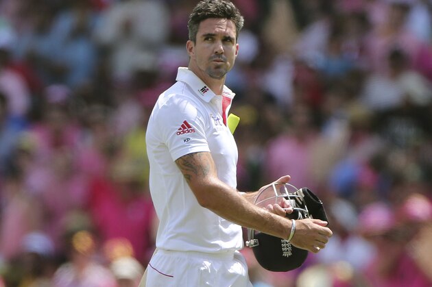 FILE - England's Kevin Pietersen walks off the field after his wicket fell on the third day of their Ashes cricket Test match in Sydney, Australia, in this file photo dated Sunday, Jan. 5, 2014.  Pietersen's England career appears to be over, it is announced Tuesday Feb. 4, 2013, after the brash batsman was not selected for the upcoming tour of West Indies.  Pietersen has attracted controversy during his playing career and accused of being a divisive influence within the England team, but he went on to play 104 Test matches, 136 one-day games and 37 Twenty20 fixtures for England. (AP Photo/Rob Griffith)